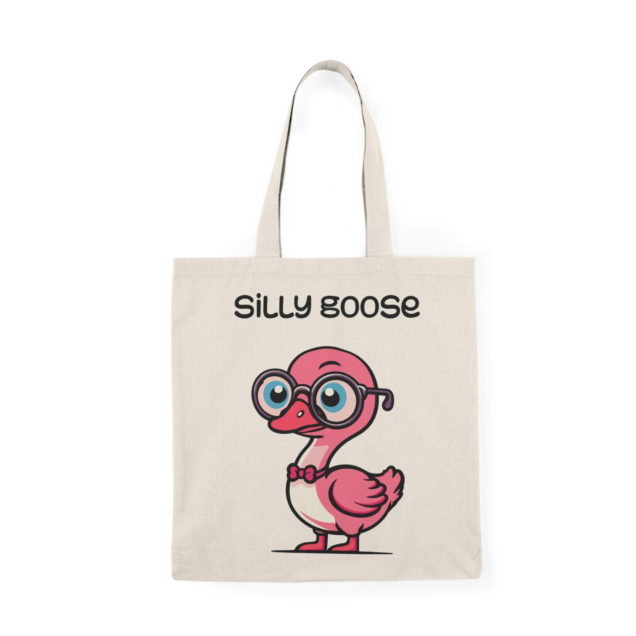 A cream tote bag featuring a playful illustration of a cartoon goose with glasses and the text 'Silly Goose.' The fun design and bright colors capture a lighthearted spirit, making it an excellent accessory for those with a sense of humor."