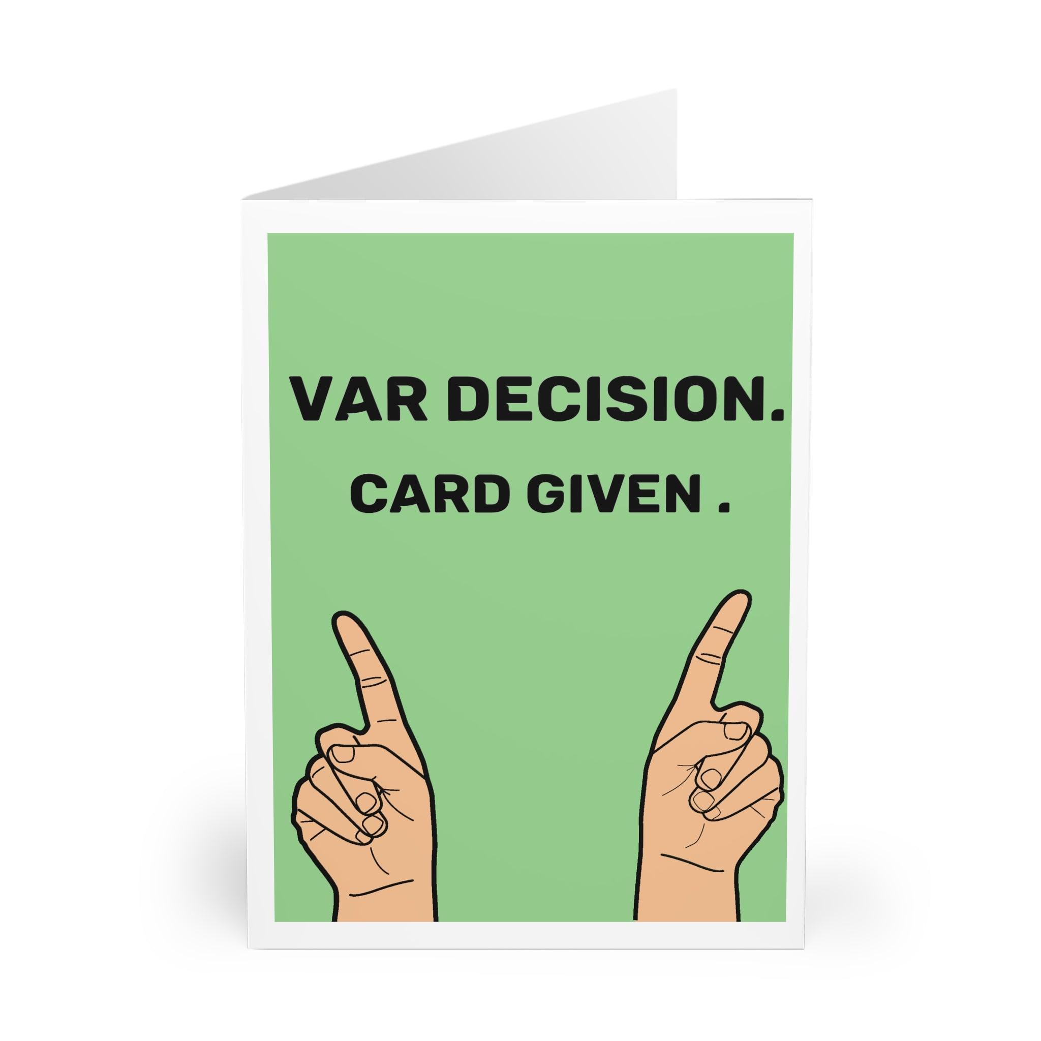 Humorous sports-themed greeting card featuring two hands holding up a green card with the phrase 'VAR Decision. Card Given.' Perfect for football (soccer) fans who enjoy a funny twist on game day - Baby Keo