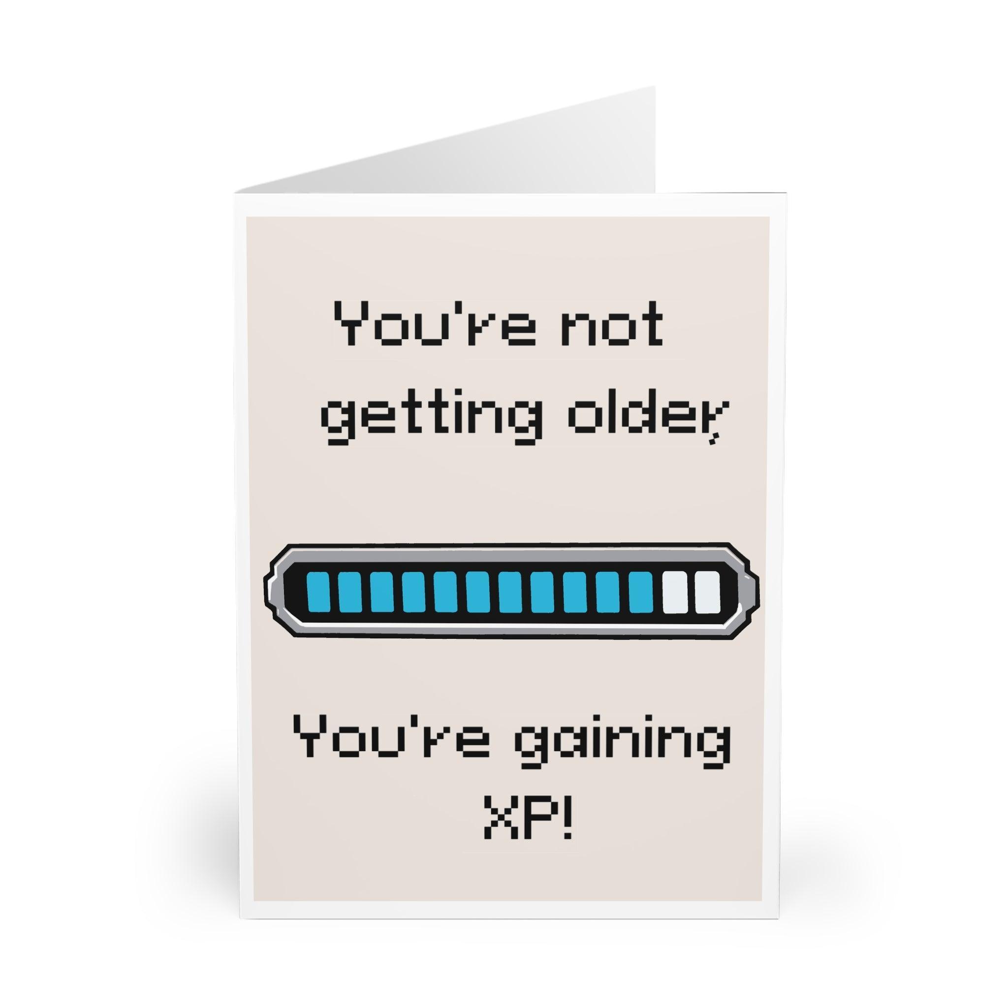 A gaming-themed card with an experience bar and the phrase 'You’re Not Older, You’re Gaining XP.' Perfect for a gamer or tech-savvy friend’s birthday - Baby Keo.