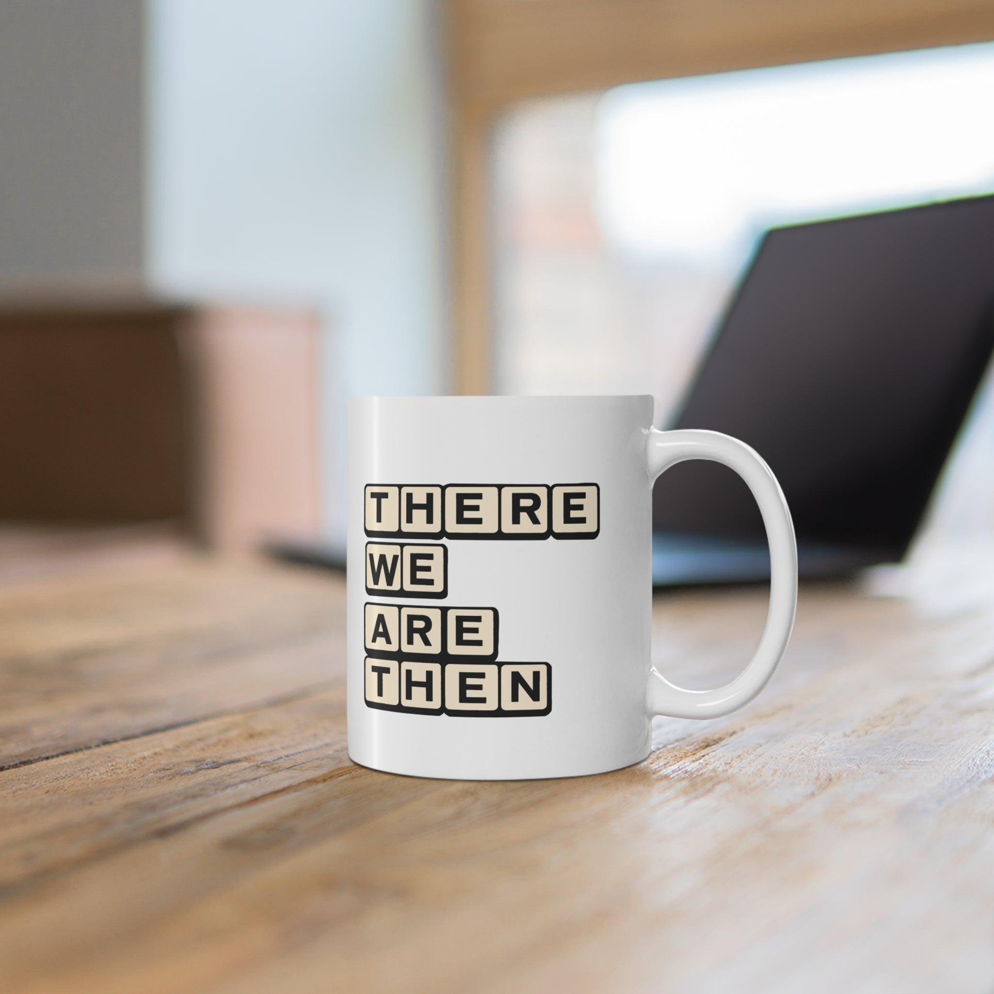 White ceramic mug with bold text 'There We Are Then TWAT,' offering a humorous and edgy design for your coffee break