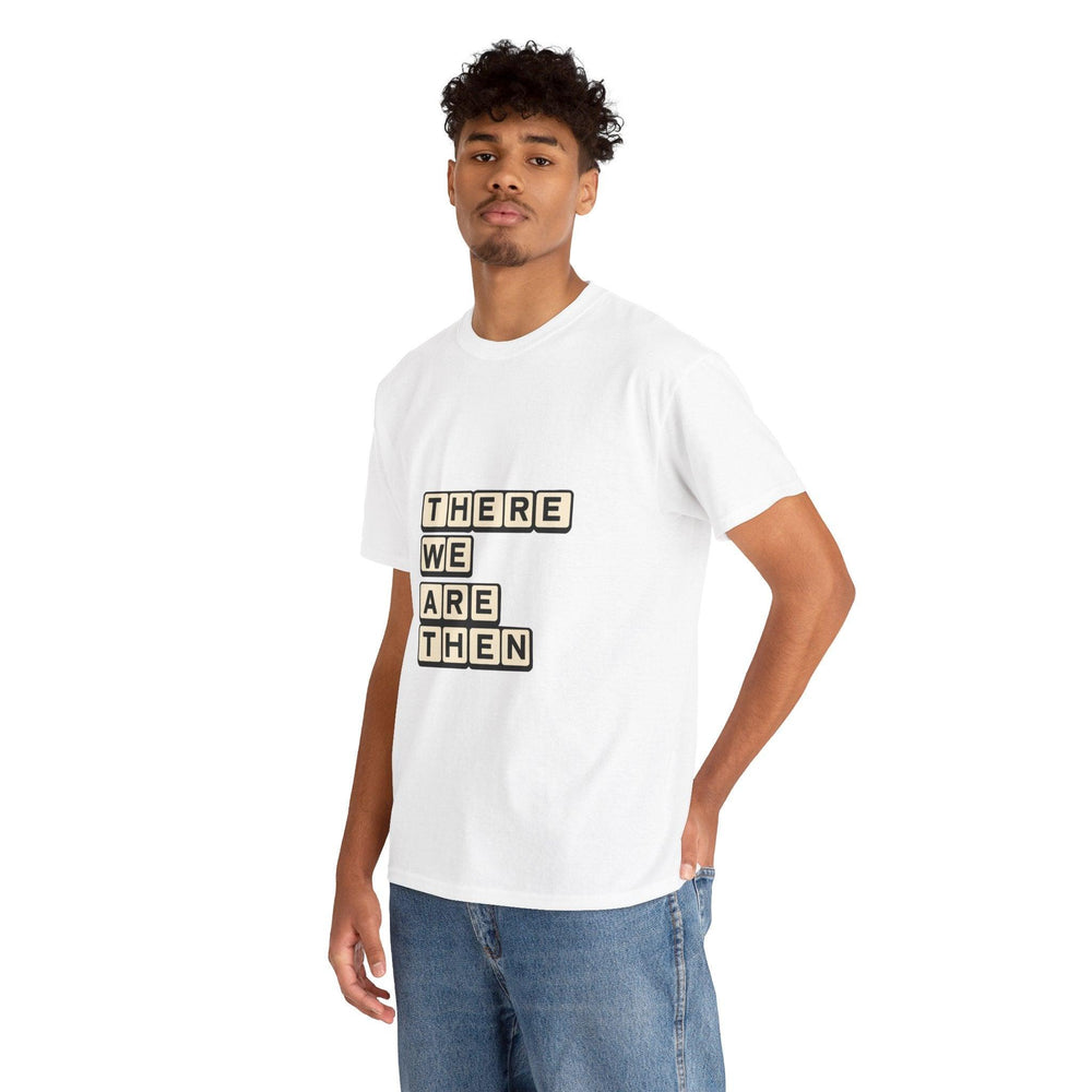 White T-shirt featuring a stylized text block with the phrase 'There We Are Then Twat.' A bold and humorous design for those who enjoy British humor and cheeky phrases."

