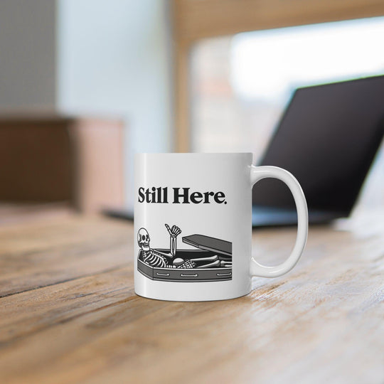Minimalistic white ceramic mug with the text &