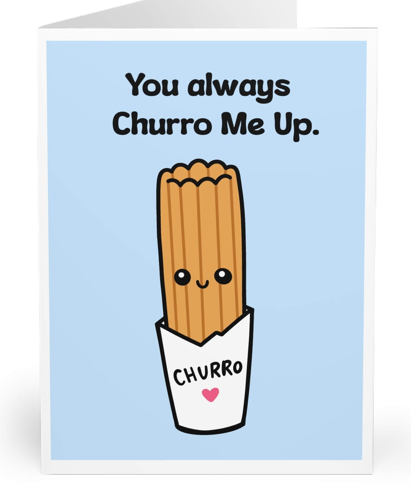 A folded greeting card shown standing upright on a white background. The card has a light blue front with the text 'You always Churro Me Up.