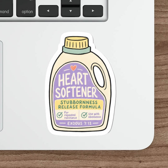 A die-cut sticker shaped like a bottle of &