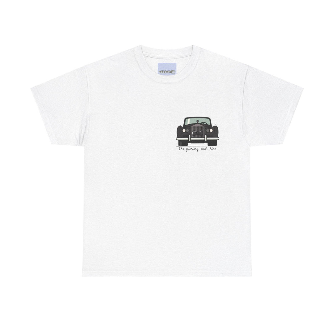 White unisex T-shirt featuring a vintage car illustration with the phrase 'It's Giving Mob Ties.' A bold design evoking a sense of old-school style and a nod to the mafia aesthetic."