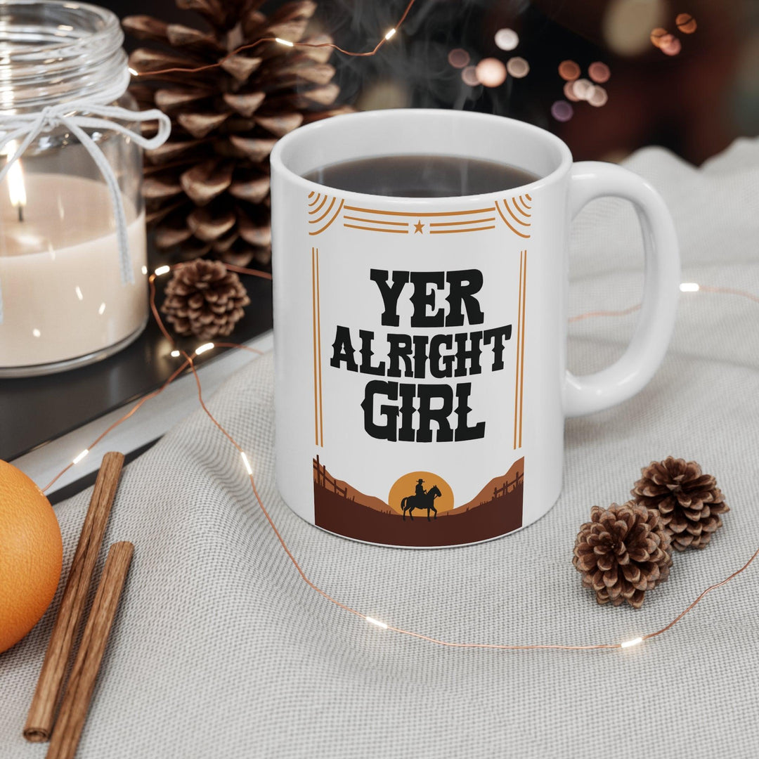 Quirky ceramic mug with a bold 'Yer Alright Girl' design, inspired by Northern humor. A great gift for friends or yourself, perfect for enjoying your morning coffee - Baby Keo