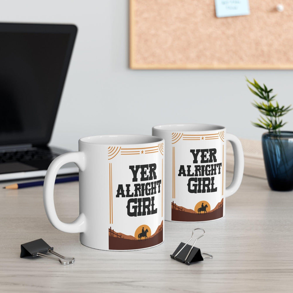 Quirky ceramic mug with a bold 'Yer Alright Girl' design, inspired by Northern humor. A great gift for friends or yourself, perfect for enjoying your morning coffee - Baby Keo