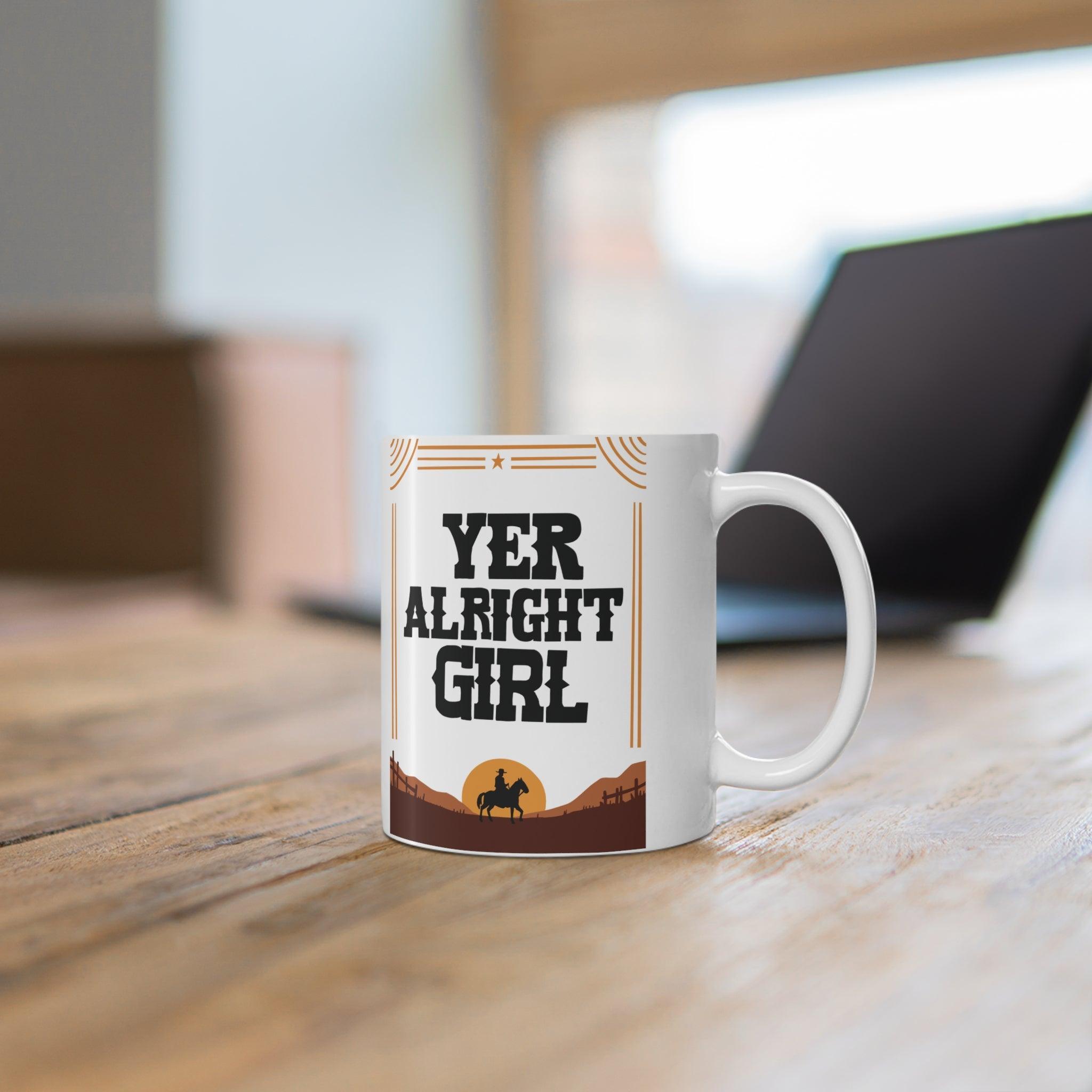 Quirky ceramic mug with a bold 'Yer Alright Girl' design, inspired by Northern humor. A great gift for friends or yourself, perfect for enjoying your morning coffee - Baby Keo