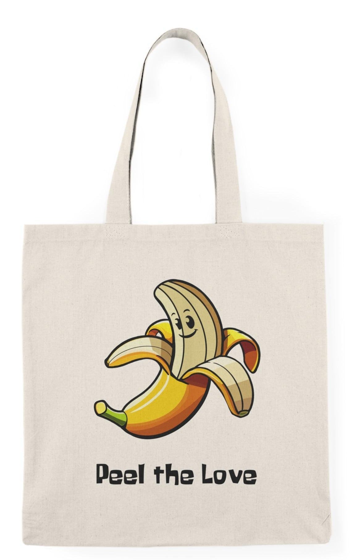 A natural canvas tote bag adorned with a whimsical graphic of a smiling banana character with the phrase 'Peel the Love.' The fun and vibrant design makes this tote a charming choice for fruit lovers and adds a playful element to everyday errands.  KEOLIX 