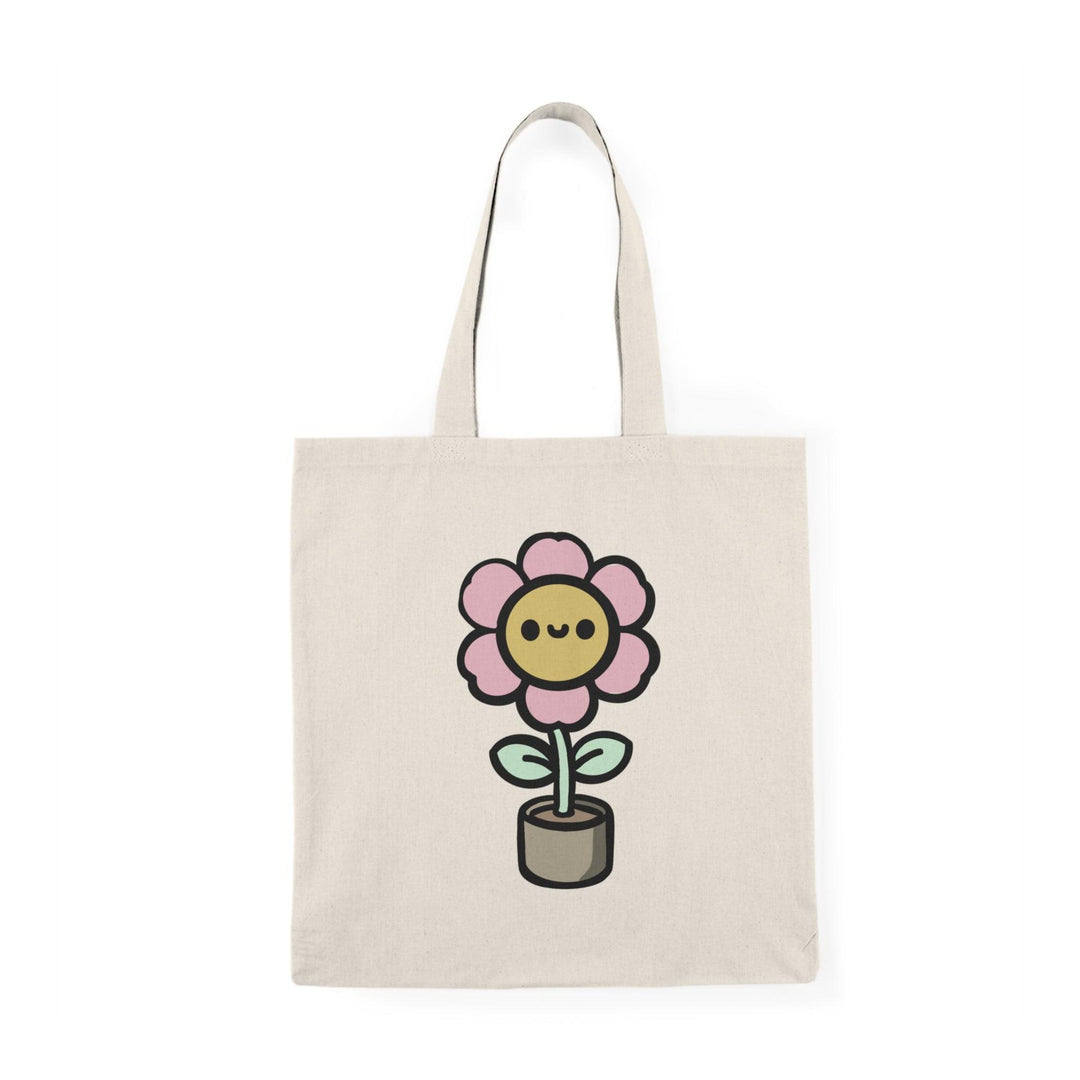 ote bag featuring a cheerful illustration of a cartoon flower blooming in a pot, with vibrant colors and a playful design. This whimsical artwork adds a touch of joy and positivity, making it a perfect accessory for plant lovers and those looking to brighten up their everyday style