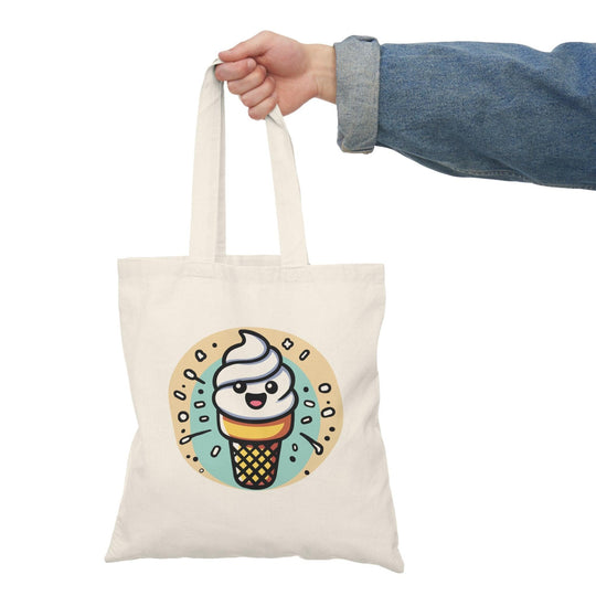 Tote bag featuring a delightful illustration of a cartoon ice cream cone topped with colorful scoops and a cherry. The cheerful design and bright colors evoke a sense of fun and sweetness, making it a perfect accessory for ice cream lovers and a playful addition to everyday outings