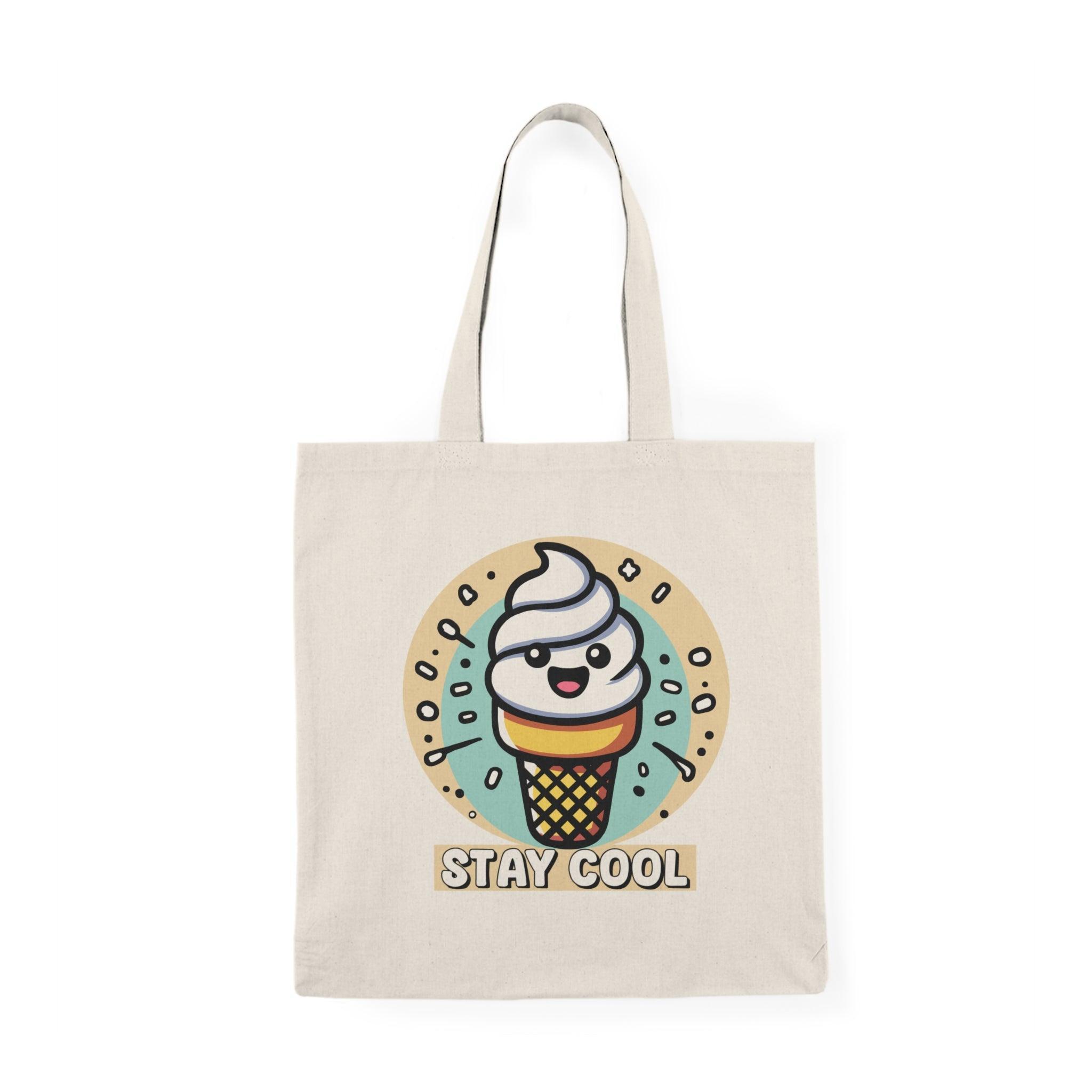 A natural canvas tote bag adorned with a fun illustration of a colorful ice cream cone topped with sprinkles and the text 'Stay Cool.' The playful design is perfect for summer outings or anyone with a sweet tooth.
