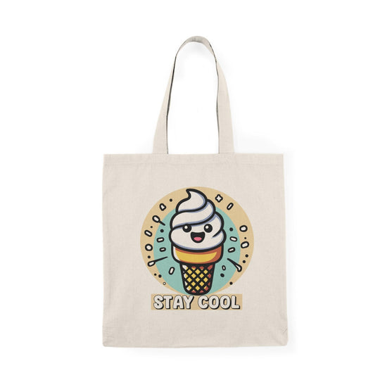 A natural canvas tote bag adorned with a fun illustration of a colorful ice cream cone topped with sprinkles and the text 'Stay Cool.' The playful design is perfect for summer outings or anyone with a sweet tooth.