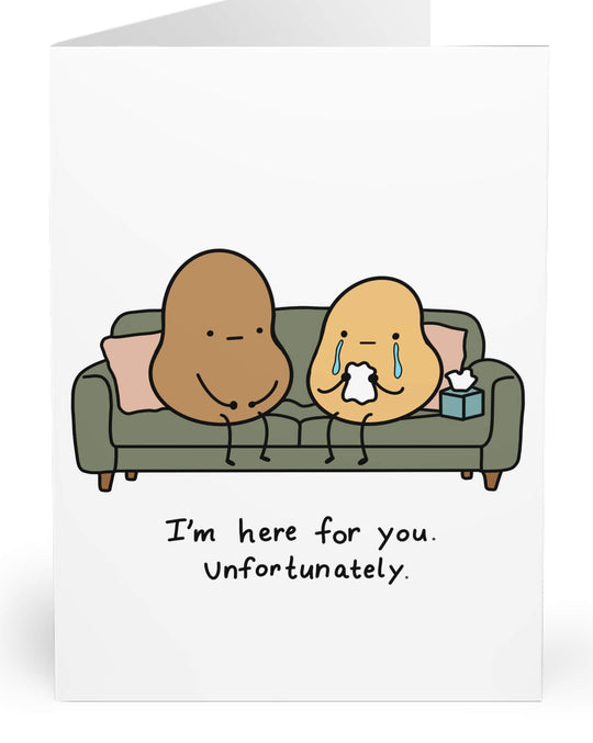 A white greeting card with a cartoon illustration of two characters sitting on a couch, one crying and holding a tissue, with the text &