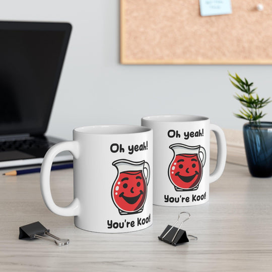 Fun white ceramic mug featuring a red Kool-Aid pitcher and the playful phrase 'Oh Yeah! You're Kool!' adding a retro vibe to your coffee routine