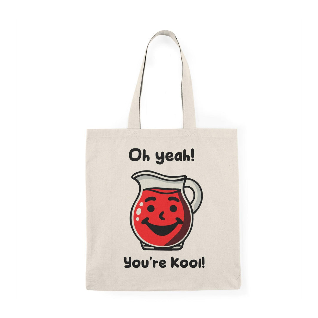 A cream-colored tote bag featuring a vibrant illustration of a Kool-Aid character with the text 'Oh yeah! You're Kool!' The cheerful design and bold colors create a fun, nostalgic vibe, perfect for anyone with a love for playful accessories.