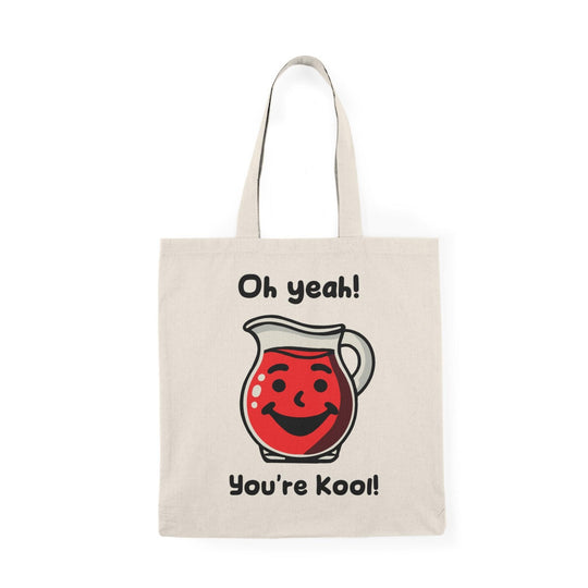 A cream-colored tote bag featuring a vibrant illustration of a Kool-Aid character with the text 'Oh yeah! You're Kool!' The cheerful design and bold colors create a fun, nostalgic vibe, perfect for anyone with a love for playful accessories.