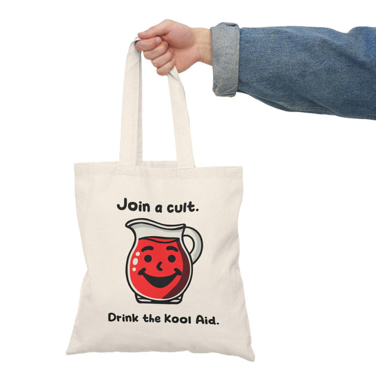 A natural tote bag showcasing a graphic of a Kool-Aid pitcher with the text 'Join a cult, Drink the Kool Aid.' The playful design incorporates a humorous take on cult culture, perfect for those with a quirky sense of style