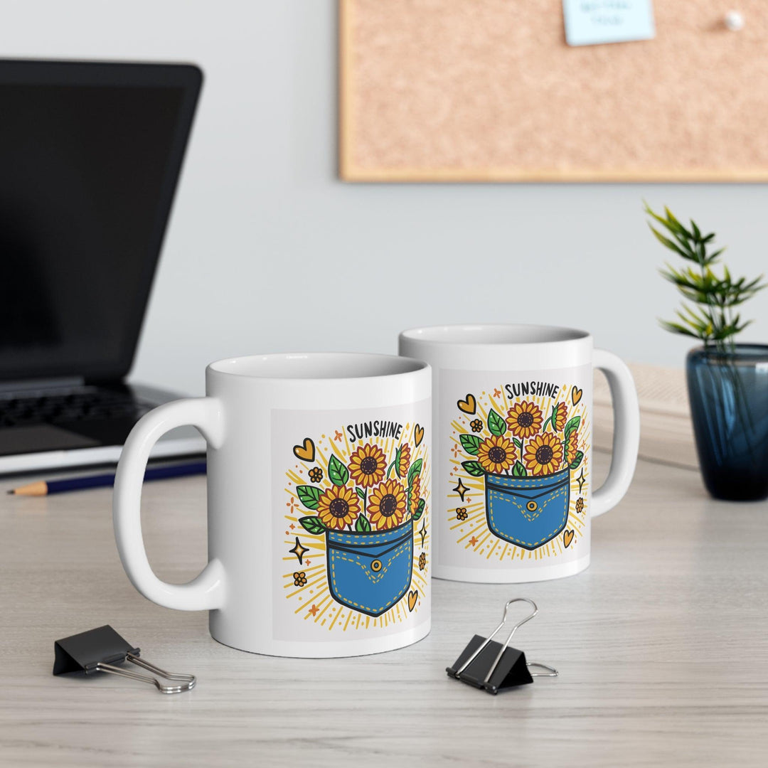 White ceramic mug featuring a sunflower design and the uplifting phrase 'Pocket Full of Sunshine,' bringing a bright and cheerful vibe to your mornings.