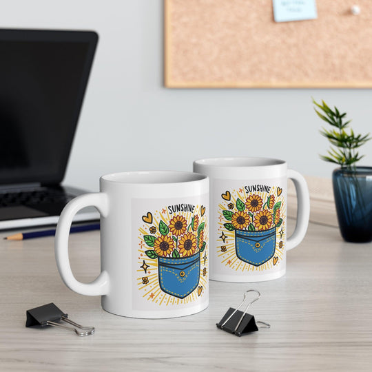 White ceramic mug featuring a sunflower design and the uplifting phrase 'Pocket Full of Sunshine,' bringing a bright and cheerful vibe to your mornings.