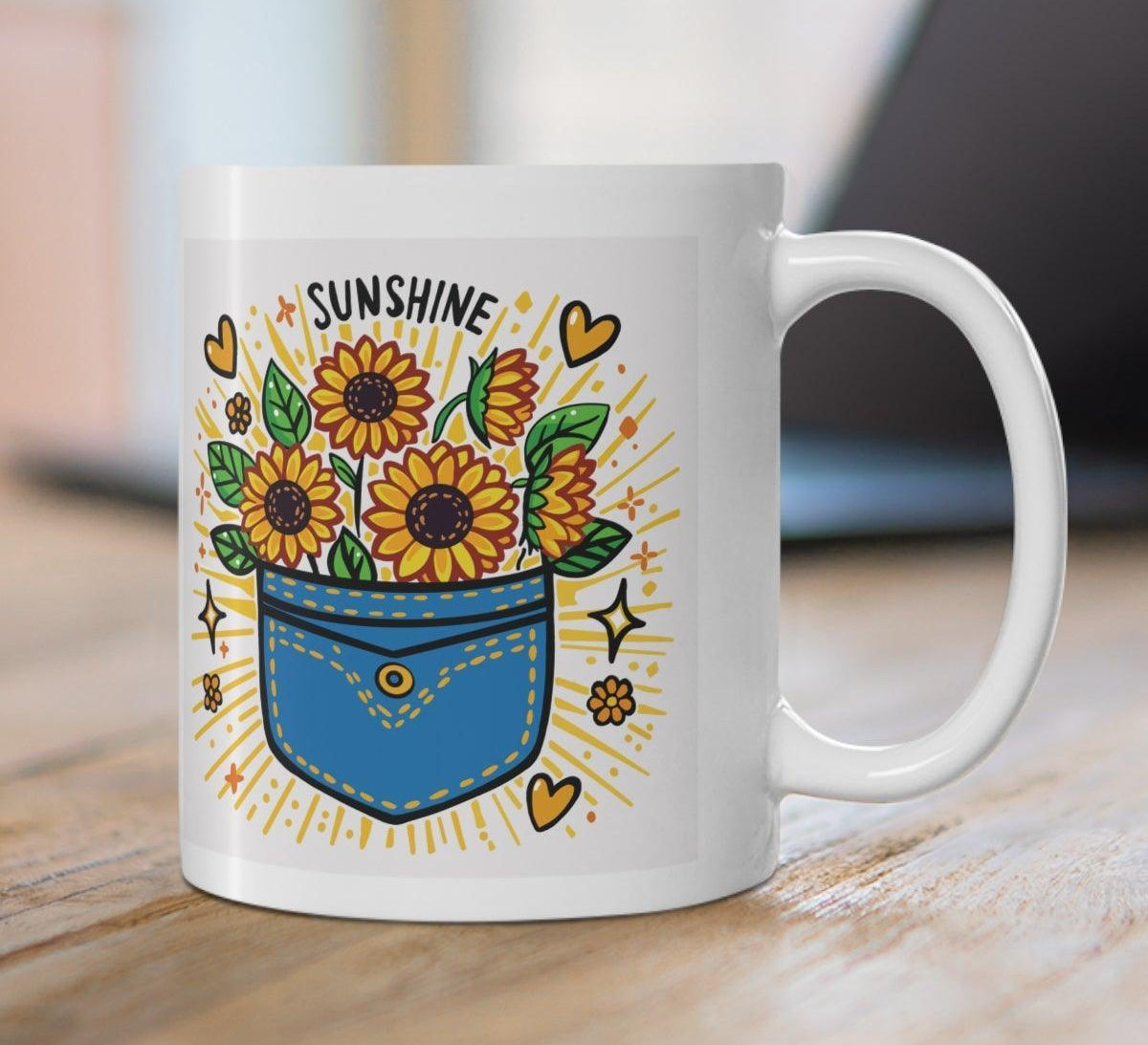 White ceramic mug featuring a sunflower design and the uplifting phrase 'Pocket Full of Sunshine,' bringing a bright and cheerful vibe to your mornings.