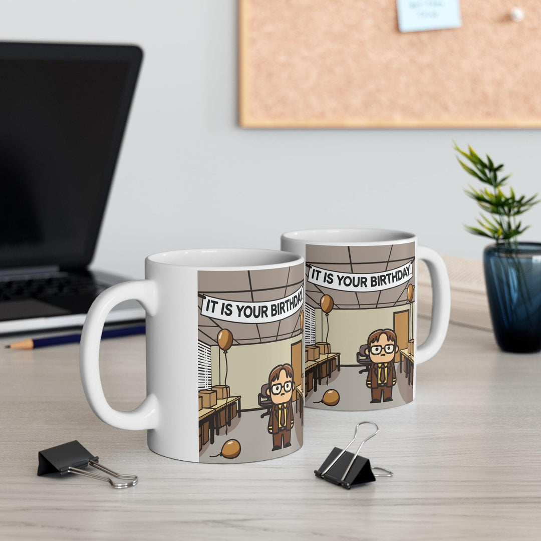 White ceramic mug featuring a reference to the iconic 'It Is Your Birthday' scene from The Office, ideal for fans of the show who enjoy a subtle nod to their favorite series