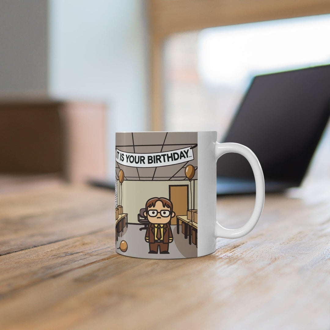 White ceramic mug featuring a reference to the iconic 'It Is Your Birthday' scene from The Office, ideal for fans of the show who enjoy a subtle nod to their favorite series
