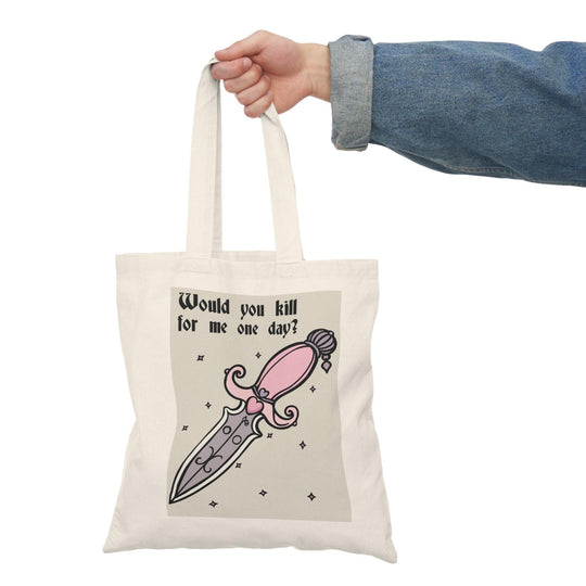 A cream tote bag featuring a humorous graphic of a cartoonish knife and the playful text 'Would You Kill for Me One Day?' This cheeky design adds a touch of dark humor, appealing to those with a quirky sense of fun