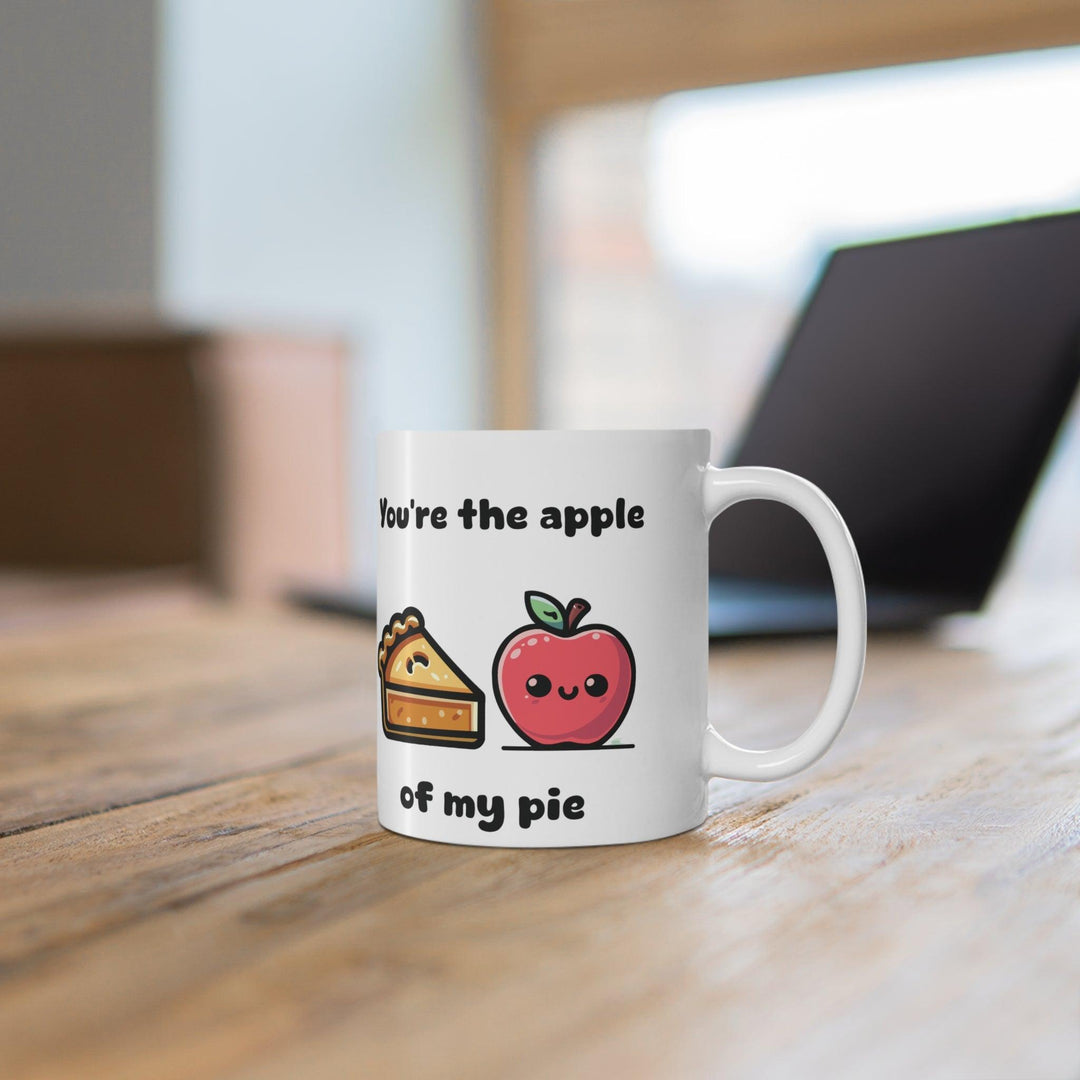 'You're the Apple of My Pie' Mug - "Charming white ceramic mug featuring an apple pie illustration and the text 'You're the Apple of My Pie,' perfect for lovers of sweet, food-themed puns."