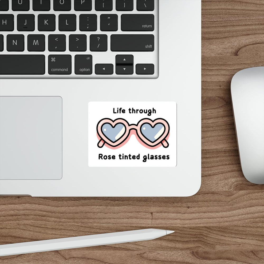  A cute pair of glasses with hearts in the lenses and the text "Life through Rose tinted glasses." A whimsical design. Baby Keo.