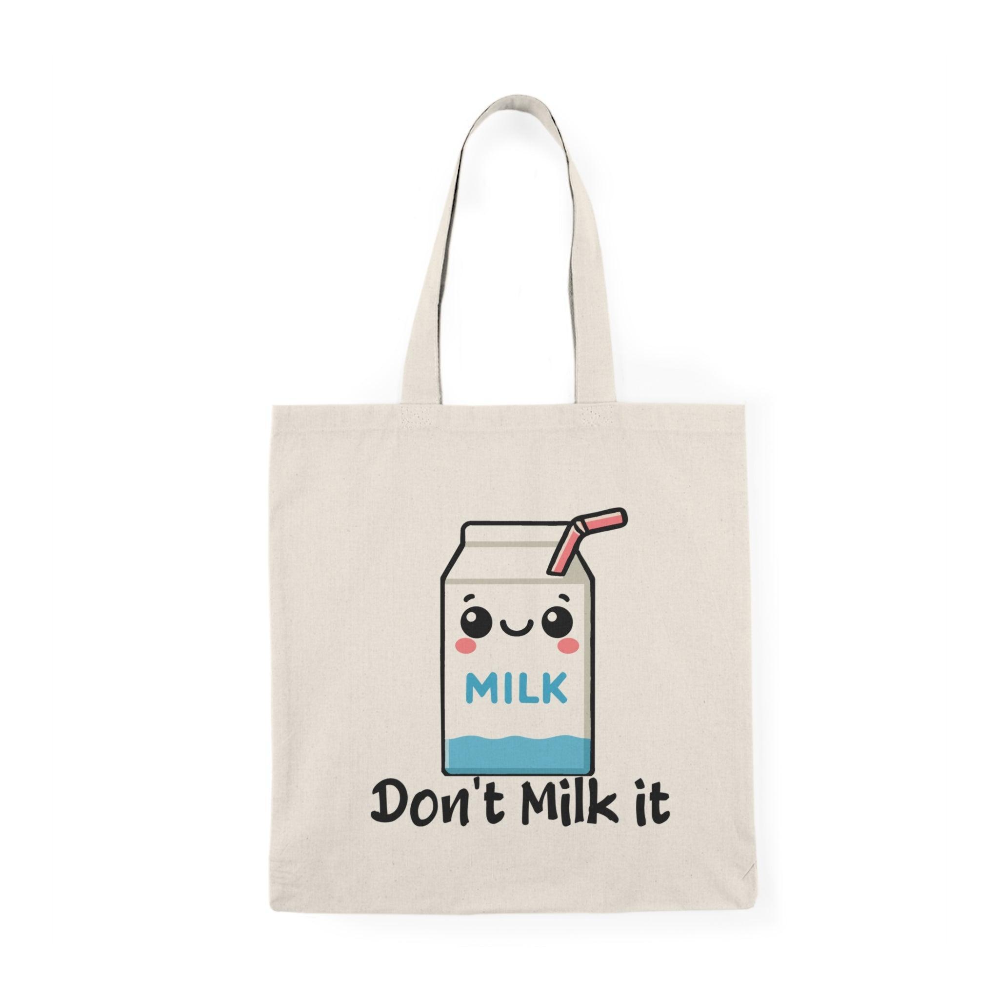 Tote bag featuring a playful illustration of a cartoon milk carton with the phrase 'Don't Milk It.' The vibrant design and cheerful graphics create a fun and whimsical accessory, perfect for adding a lighthearted touch to your everyday style while showcasing a love for dairy.