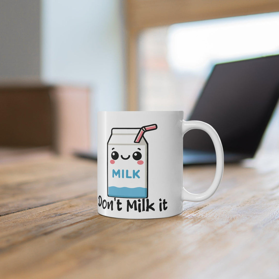 White ceramic mug featuring a cute milk carton illustration with the humorous phrase 'Don't Milk it,' adding a playful touch to your coffee break