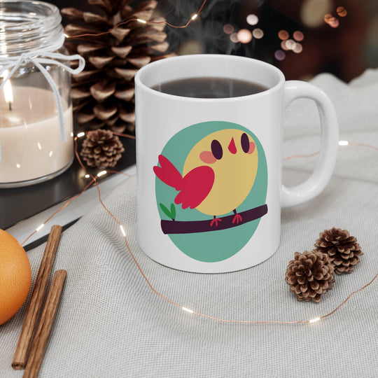 Vibrant white ceramic mug showcasing a cheerful cartoon bird perched on a branch, adding a touch of nature and whimsy to your morning routine