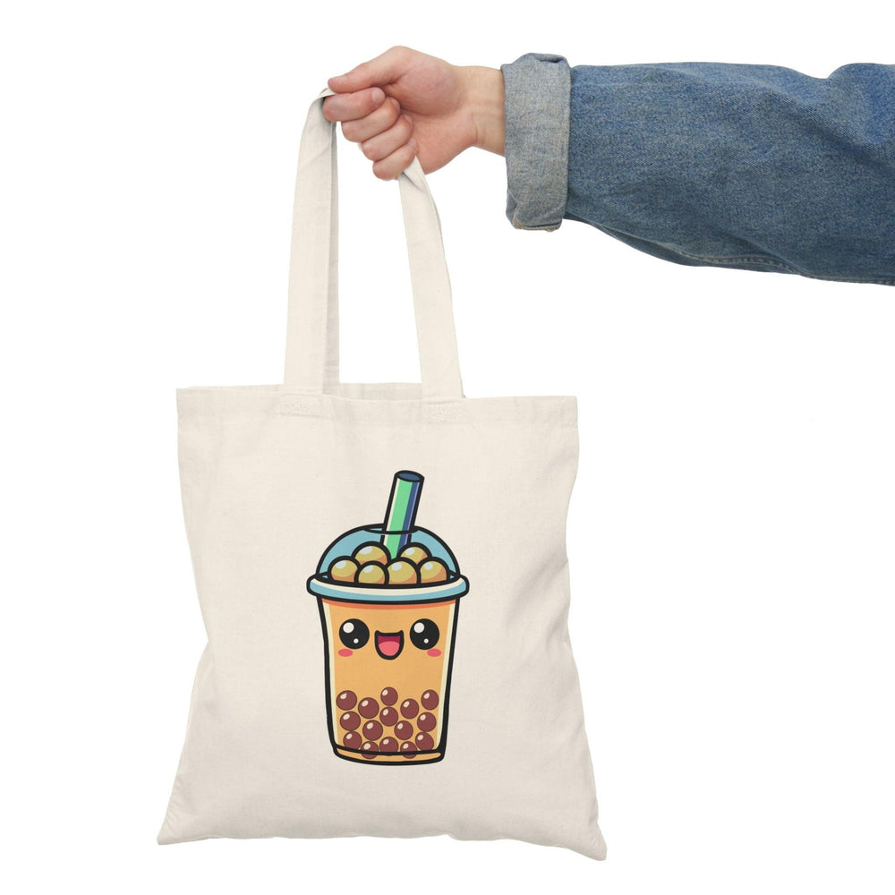 tote bag featuring a fun illustration of a cartoon bubble tea cup, complete with colorful tapioca pearls and a playful straw. The vibrant design and cheerful colors make it an adorable accessory for bubble tea enthusiasts, perfect for carrying essentials while showcasing a love for this trendy drink.