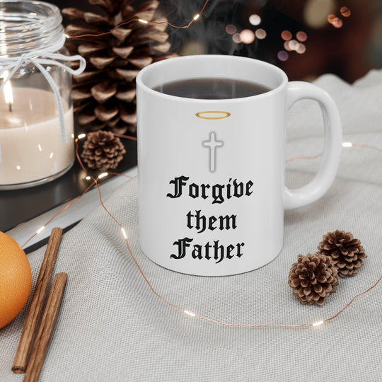 Classic white ceramic mug featuring praying hands and the text 'Forgive Them Father,' ideal for those who appreciate faith-inspired designs.