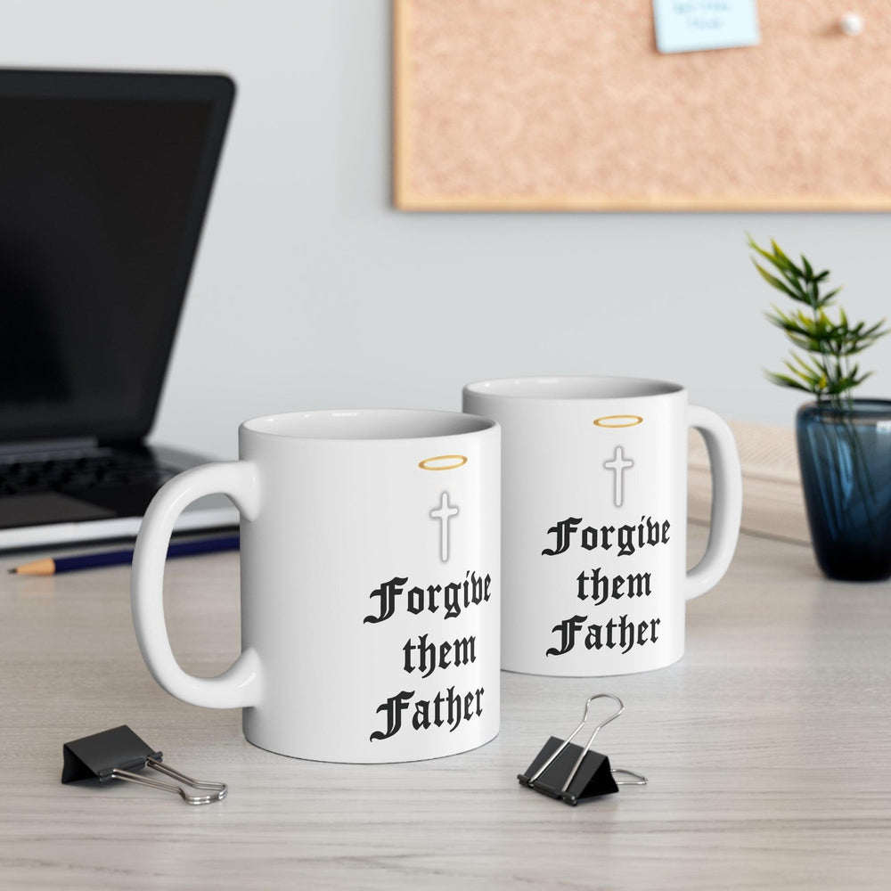 Classic white ceramic mug featuring praying hands and the text 'Forgive Them Father,' ideal for those who appreciate faith-inspired designs.