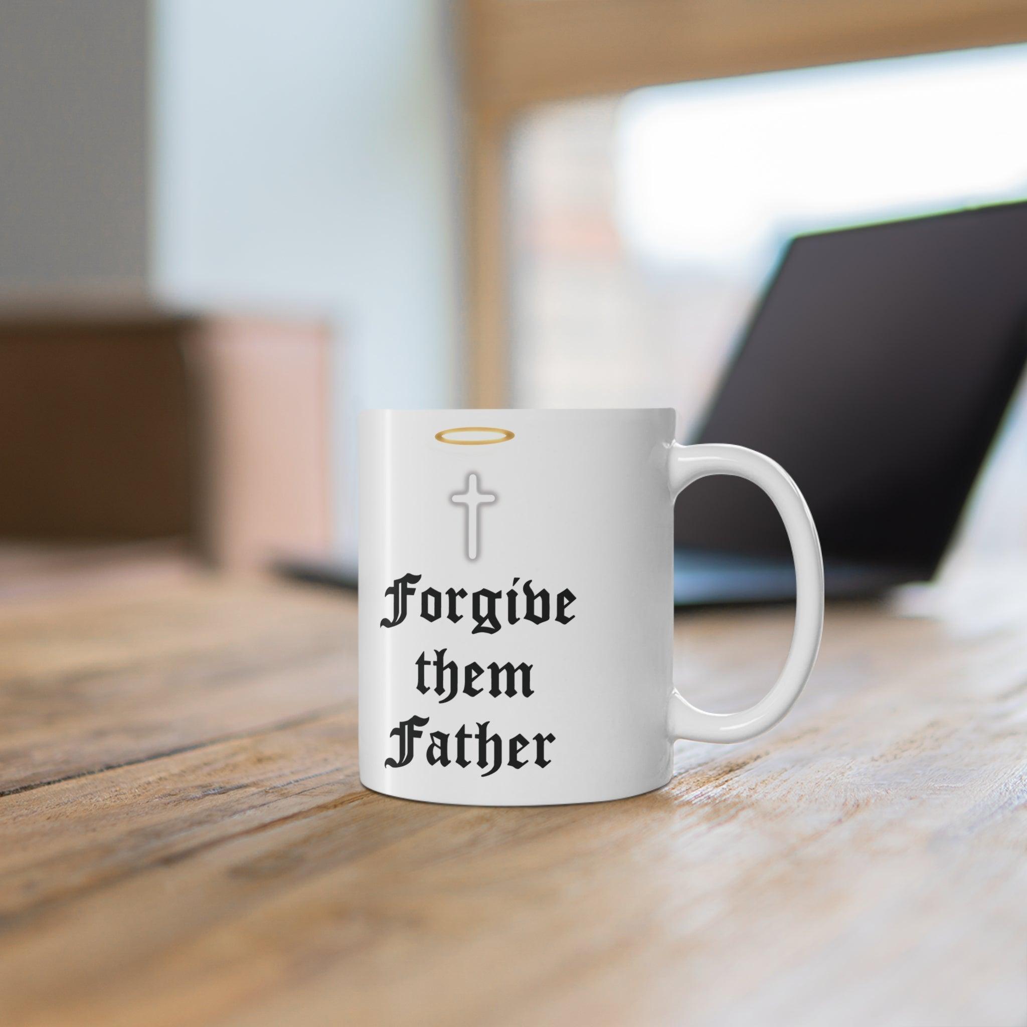 Classic white ceramic mug featuring praying hands and the text 'Forgive Them Father,' ideal for those who appreciate faith-inspired designs.