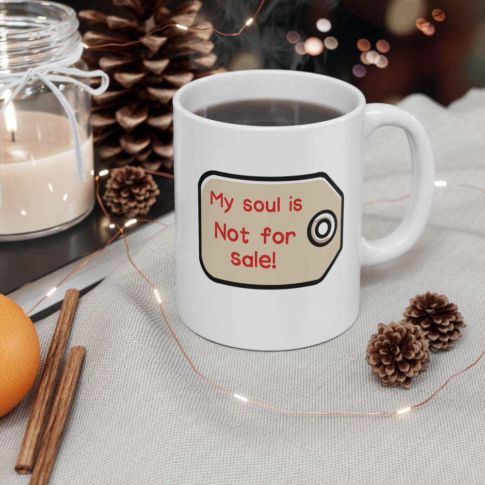 My soul is Bold white ceramic mug with a dramatic eye illustration and the text 'My Soul Is Not For Sale,' offering a statement piece for those who value their integrity. for sale Mug - Baby Keo