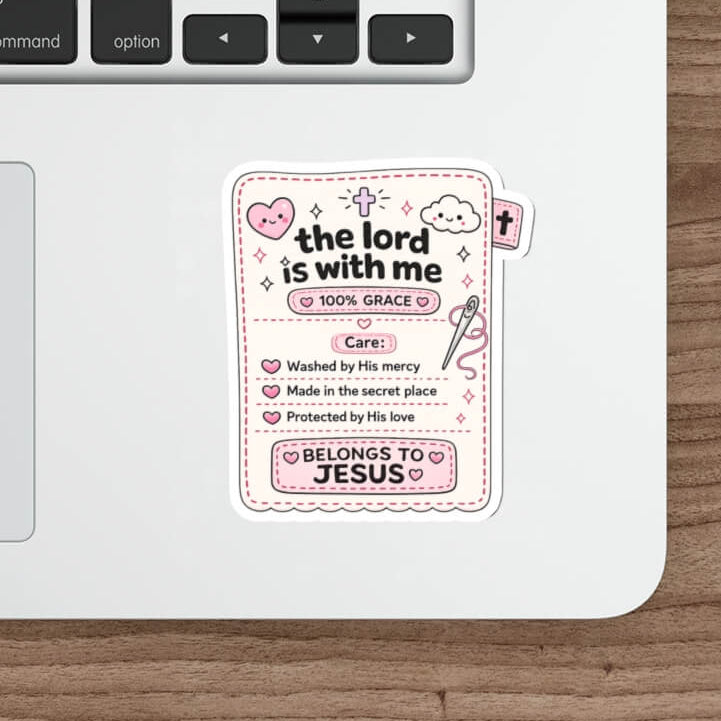 Cute Genesis 39 Christian sticker designed as a kawaii sewn clothing label featuring the words The Lord Is With Me, 100% Grace, Made in the secret place and Belongs To Jesus.