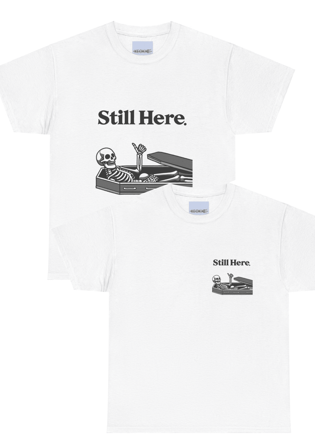White T-shirt featuring a laid-back skeleton lounging on a chaise with the phrase 'Still Here.' A light-hearted design, perfect for embracing perseverance with a twist of humor."