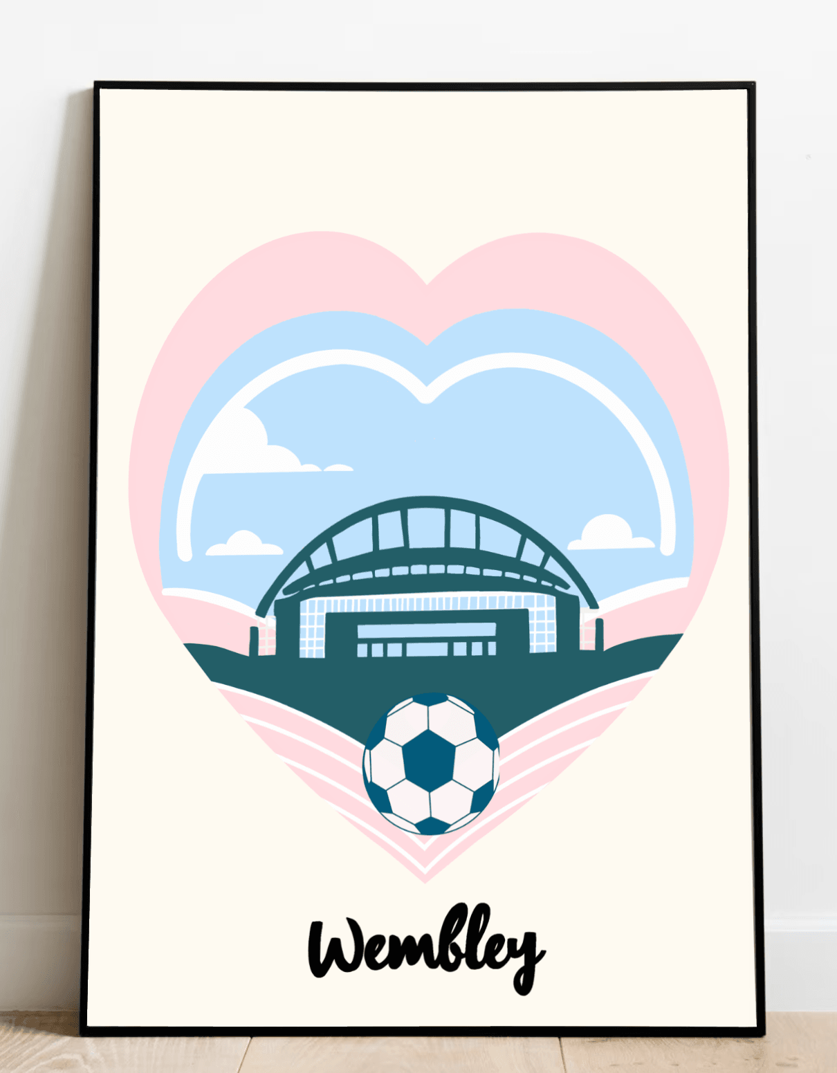 Add a touch of charm to your space with "The Wembley Essence" - an eye-catching Minimalist Football Print that's sure to capture hearts! This beautifully designed print rests gracefully on a wooden floor against a crisp white wall. It features the iconic Wembley Stadium nestled inside a vibrant blue heart outlined in playful pink, complete with a soccer ball poised perfectly at the tip. The word "Wembley" stands proudly beneath, perfectly encapsulating its spirit. Let this timeless piece bring elegance and 