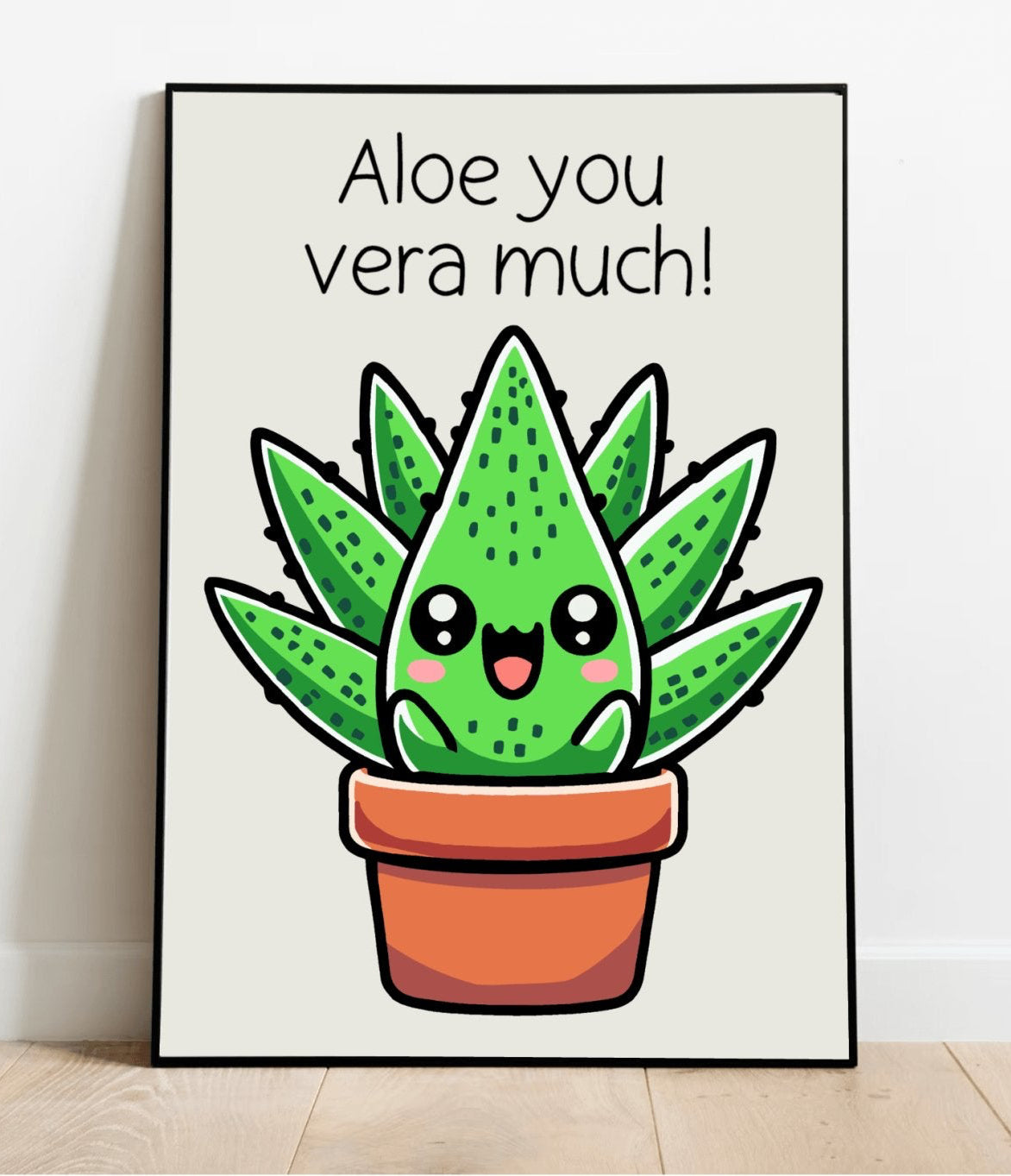 A framed art print with a cartoon illustration of an aloe vera plant with a smiling face in a brown pot, with the phrase 'Aloe you vera much!' written at the top.