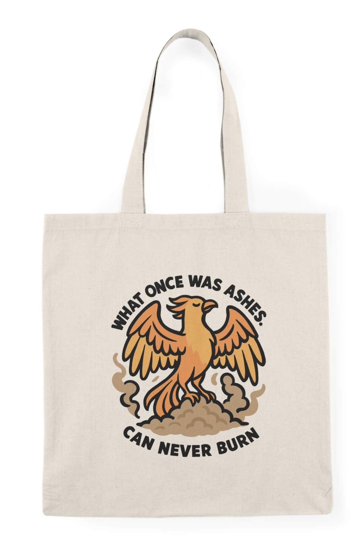 Tote bag with a fierce orange phoenix rising from smoke with bold black text that reads: "What once was ashes can never burn."