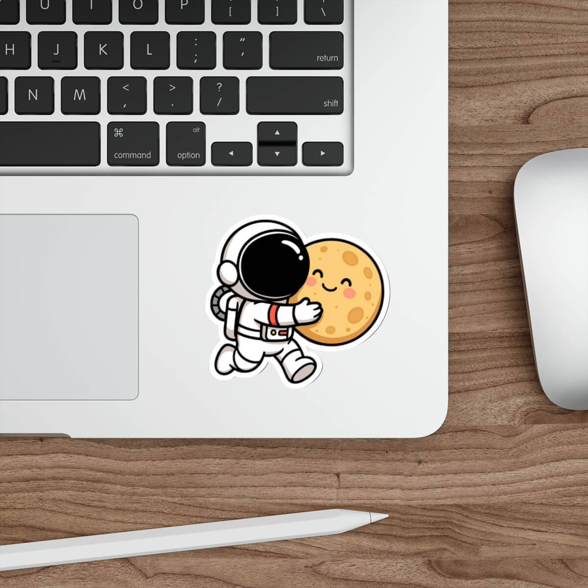 Cute vinyl sticker of a cartoon astronaut hugging a smiling moon, placed on a skateboard deck.