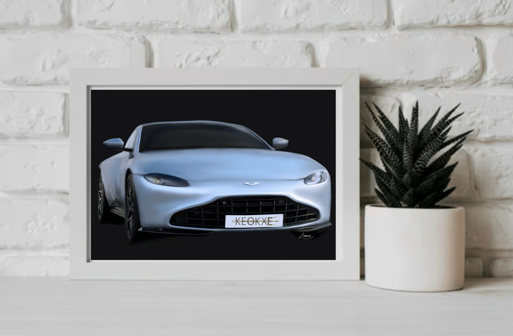 Discover the Enchanting Aston Martin Artwork – a London Car Print that’s sure to captivate any car enthusiast! This stunning piece showcases a sleek silver Aston Martin with an aerodynamic design, beautifully set against a striking black background. The custom license plate, proudly displaying "KEOKE," adds a unique touch. Positioned elegantly on a light wooden floor and backed by a simple white wall, this artwork effortlessly captures the charm of a London shopfront. Perfect for adding that sophisticated f