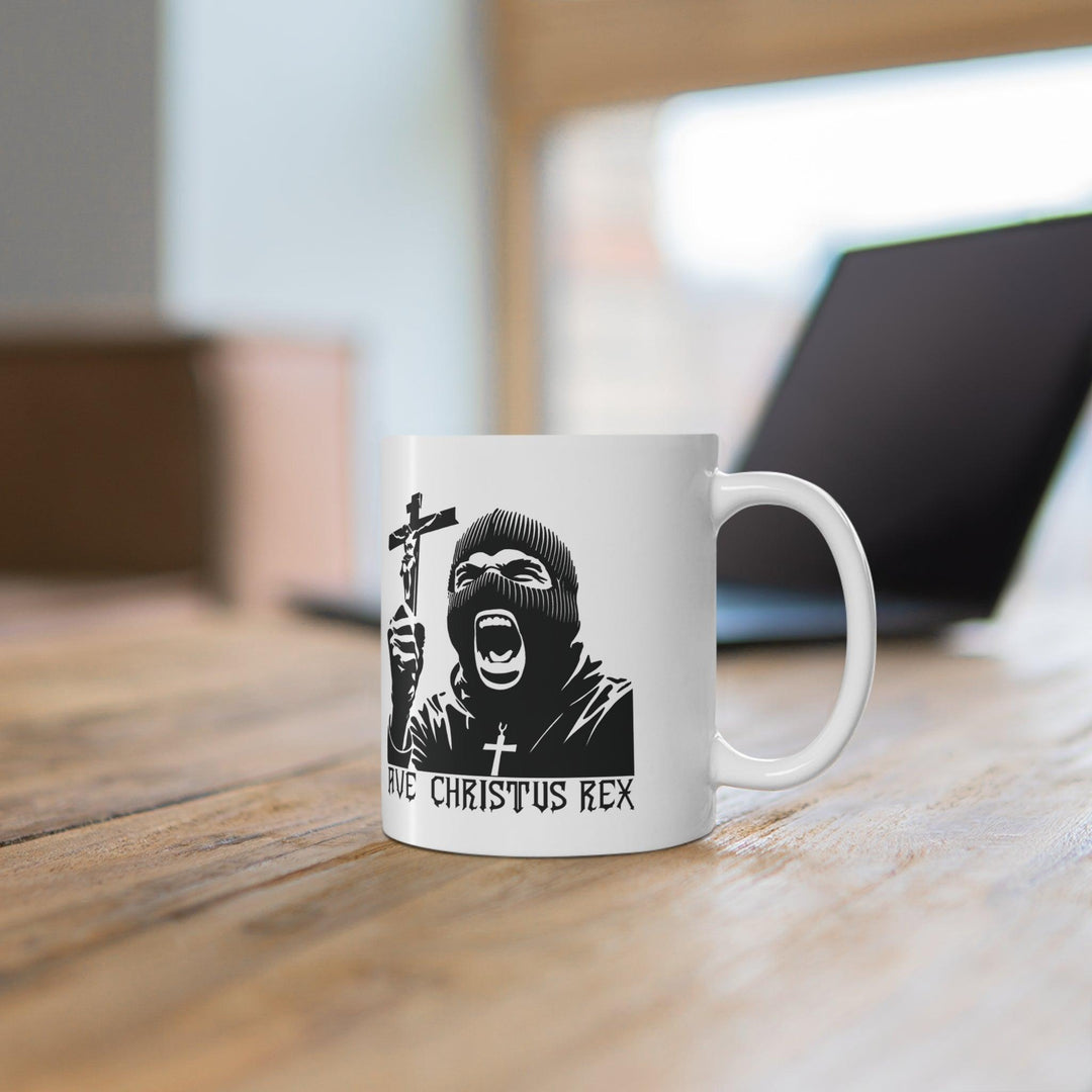 Bold black-and-white mug featuring a dramatic image of Christ with the text 'Ave Christus Rex,' perfect for a statement coffee break