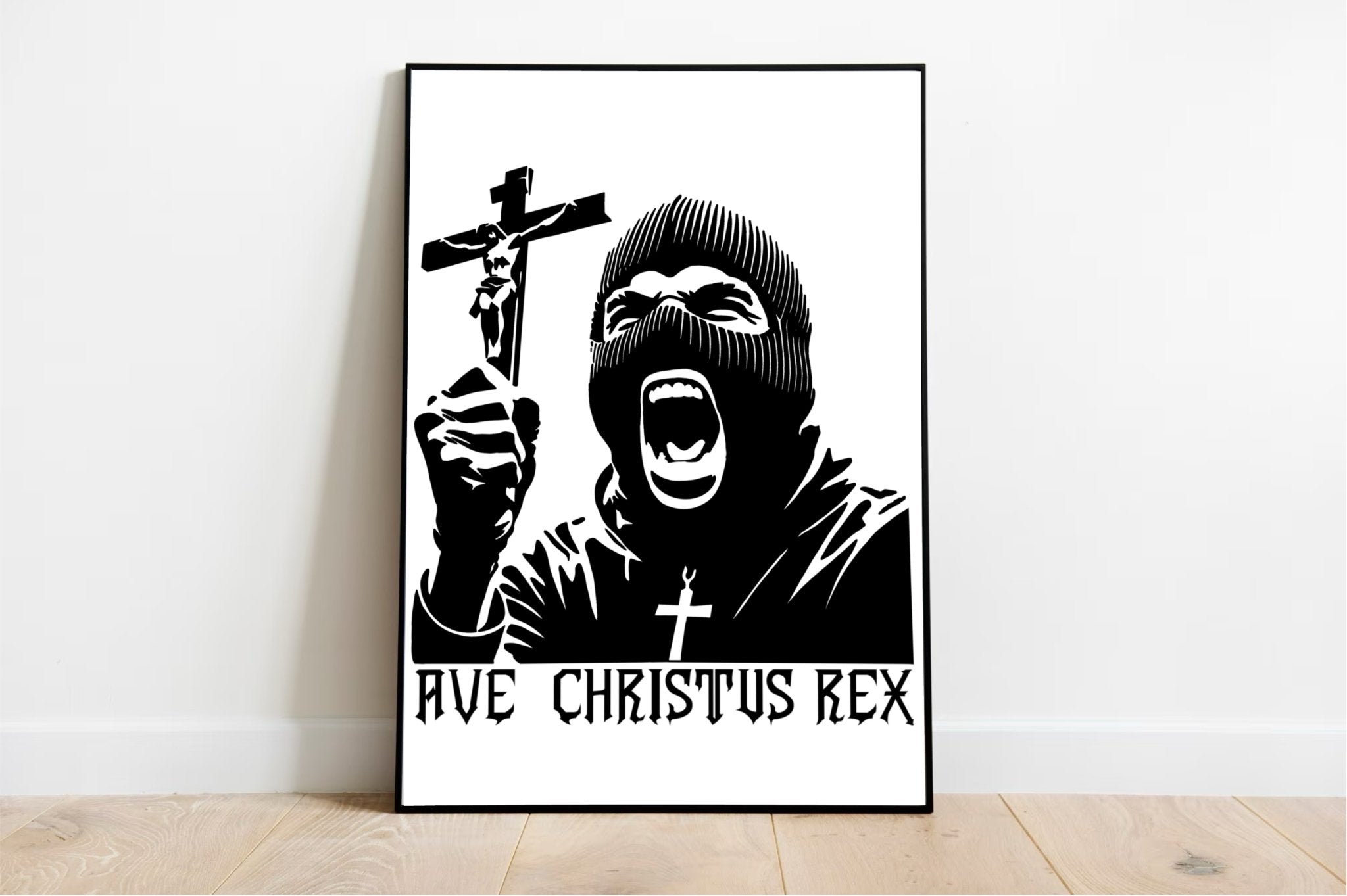 Introducing the "Ave Christus Rex Print"—a mesmerizing black and white masterpiece that captures an individual in a balaclava passionately holding up a crucifix. The striking phrase "AVE CHRISTUS REX" boldly adorns the bottom, adding to its commanding presence. This exquisite piece of religious art comes beautifully framed, ready to grace your space as it rests elegantly on a wooden floor against a clean white wall. Perfect for creating an inspiring focal point in any room!