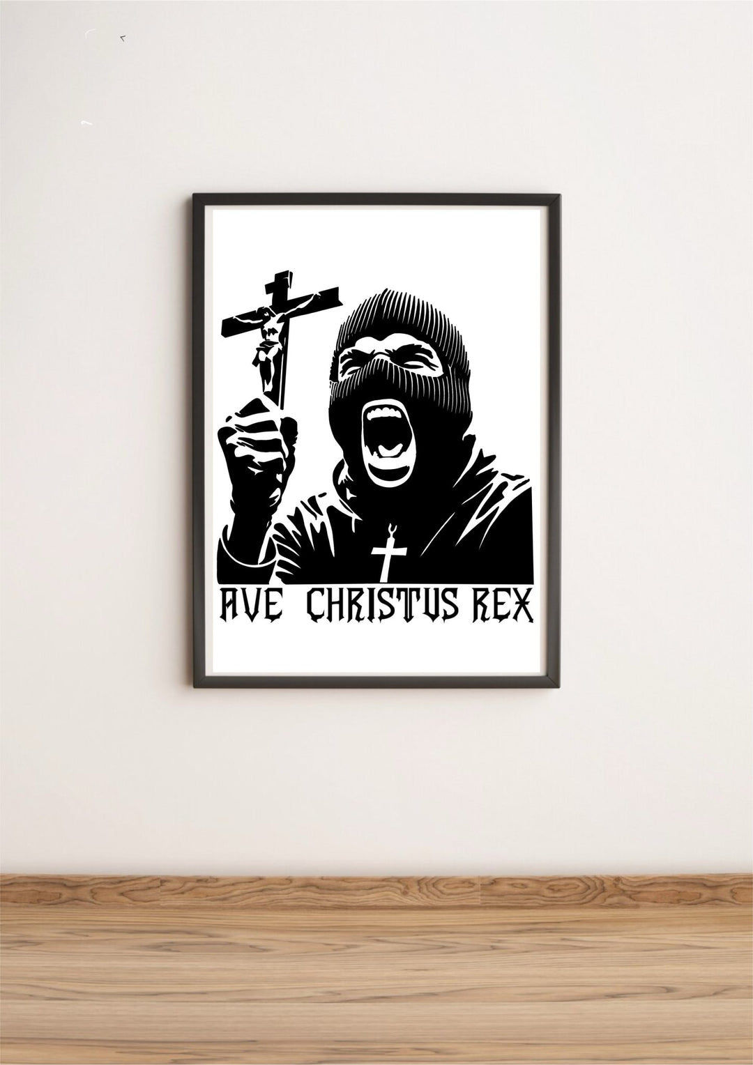 Introducing the "Ave Christus Rex Print"—a mesmerizing black and white masterpiece that captures an individual in a balaclava passionately holding up a crucifix. The striking phrase "AVE CHRISTUS REX" boldly adorns the bottom, adding to its commanding presence. This exquisite piece of religious art comes beautifully framed, ready to grace your space as it rests elegantly on a wooden floor against a clean white wall. Perfect for creating an inspiring focal point in any room!