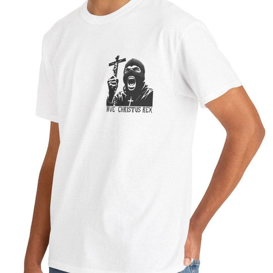 White T-shirt displaying a dramatic black-and-white religious illustration of a figure holding a crucifix, with the text 'Ave Christus Rex.' A bold and striking design for those drawn to faith-inspired artwork