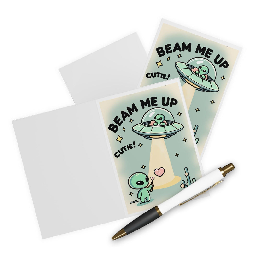 Adorable greeting card featuring a smiling alien and the phrase 'Beam Me Up, Cutie!' Perfect for sci-fi lovers or anyone who enjoys a cute and quirky card - Baby Keo.